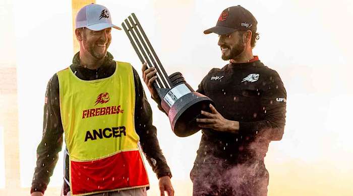Abraham Ancer of Fireballs GC celebrates with his caddie, Benji Thompson, during the trophy ceremony after the final round of 2024 LIV Golf Hong Kong at the Hong Kong Golf Club.